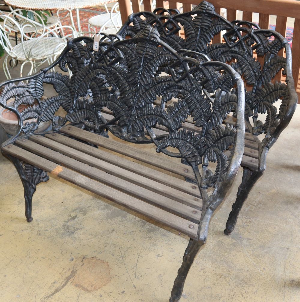 A pair of Coalbrookdale-style cast iron garden benches, W.114cm, D.48cm, H.85cm